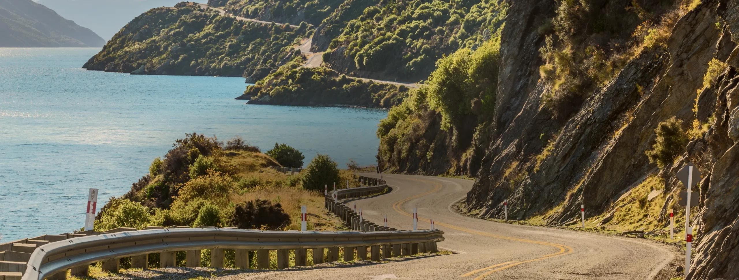 Evolve Rentals car parked in Queenstown with mountain backdrop